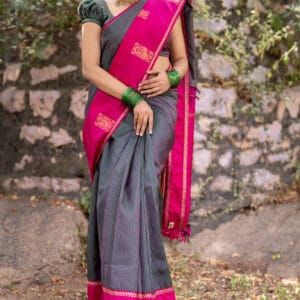 A vintage kanjivaram checks pattu saree with a gap border with a peacock butties