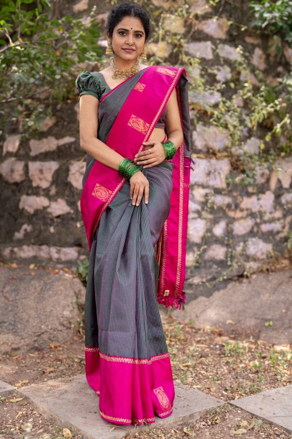 A vintage kanjivaram checks pattu saree with a gap border with a peacock butties