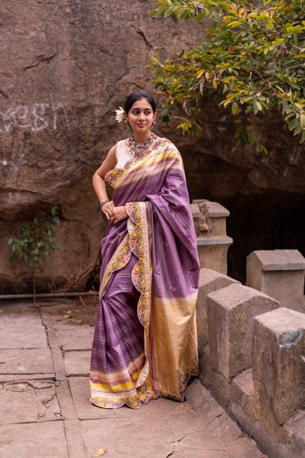 A classic kanjivaram saree with a monochromatic shades of lilac with a contrast multi colour horizontal stripe border - Image 6