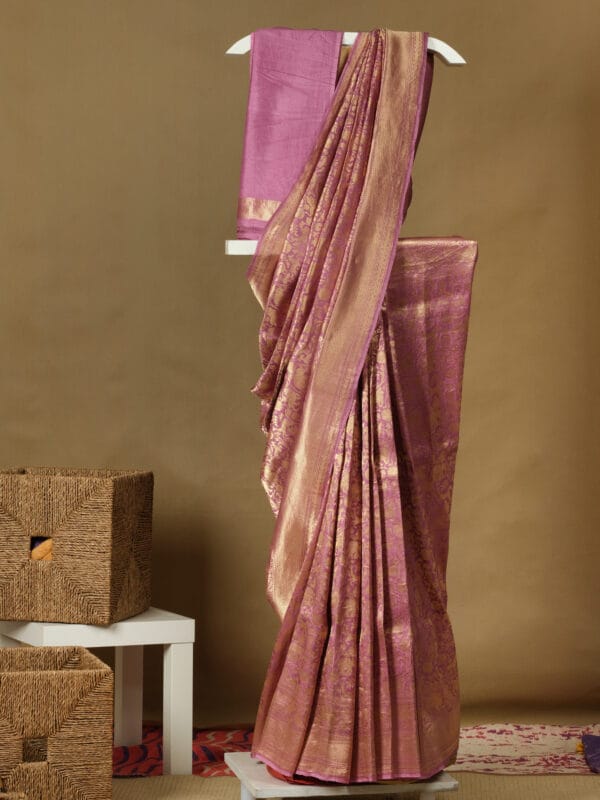 Banarasi saree with all over animal print woven in zari with a zari border & pallu gives exquisite look