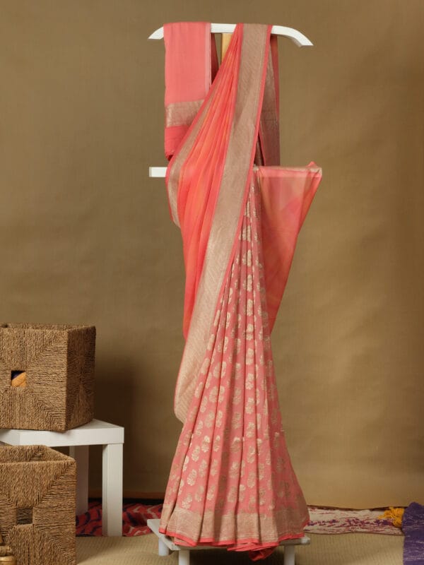 A Banaras georgette half & half with a zari butties in the pleat