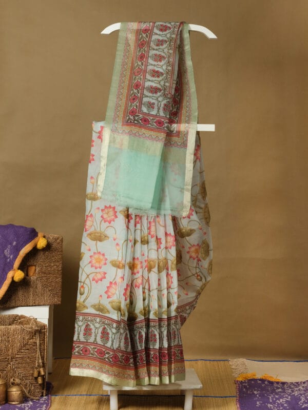 A banarasi organza with a sleek zari border & digital printed pichwai design
