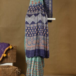 A modal silk with ajrakh prints in a pastel shade with a contrast pallu
