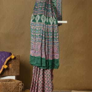 A modal silk with ajrakh prints in a pastel shade impacts a customary touch