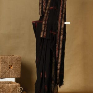 A handloom chanderi with block & rogan print silk with a zari border.