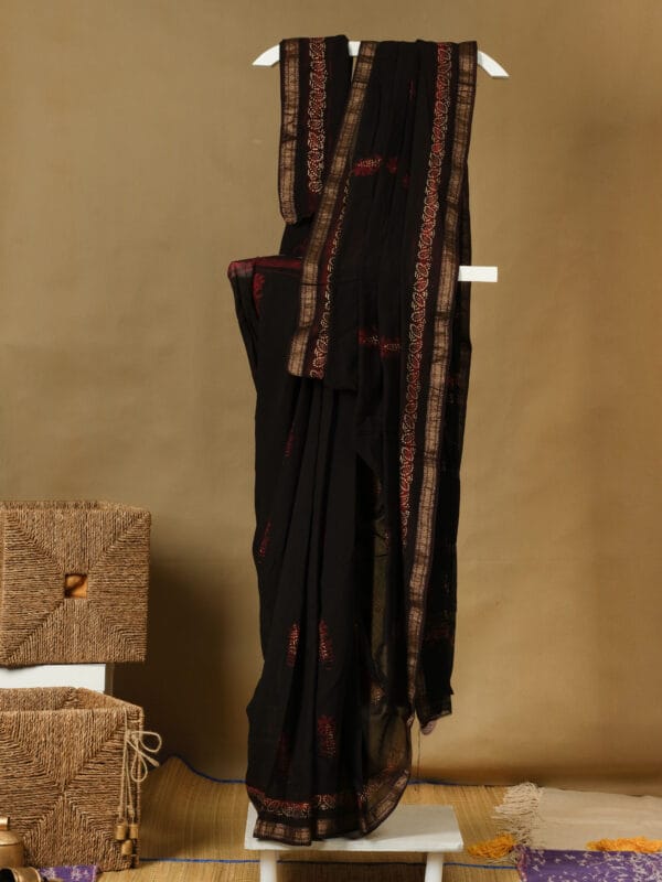 A handloom chanderi with block & rogan print silk with a zari border.