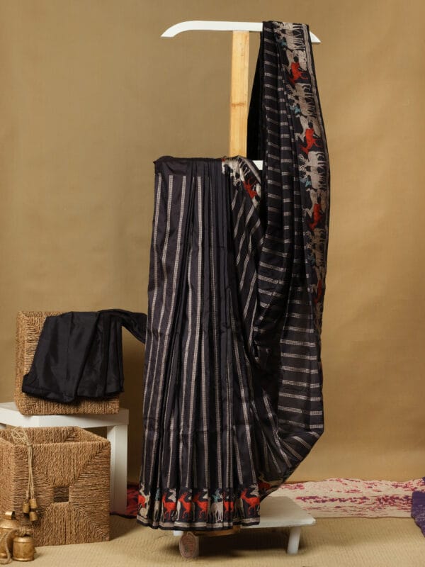 A pure banarasi silk with a vertical silver lines & a hand woven deer motifs in zari border gives a refined look.